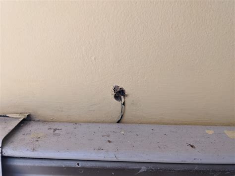 drilled through exterior brick wall and found a metal bracket|metal plate behind drywall reddit.